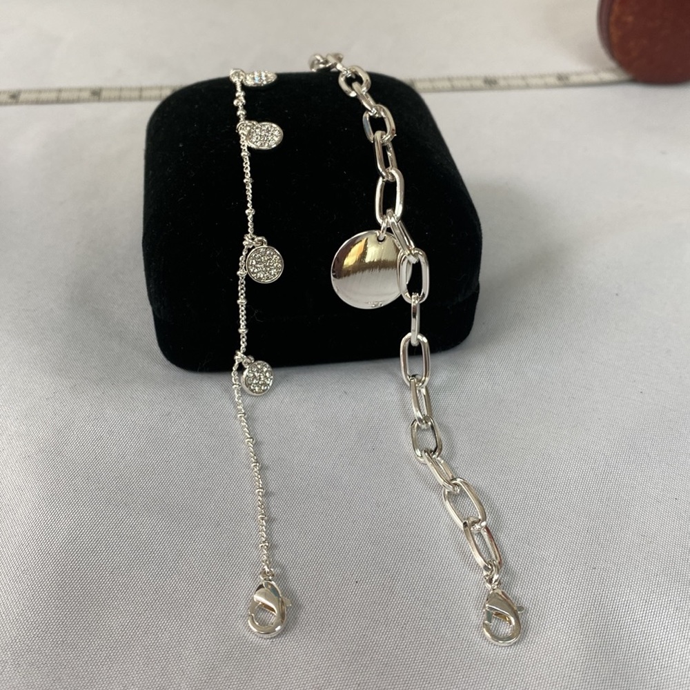 Two dainty silvertone bracelets